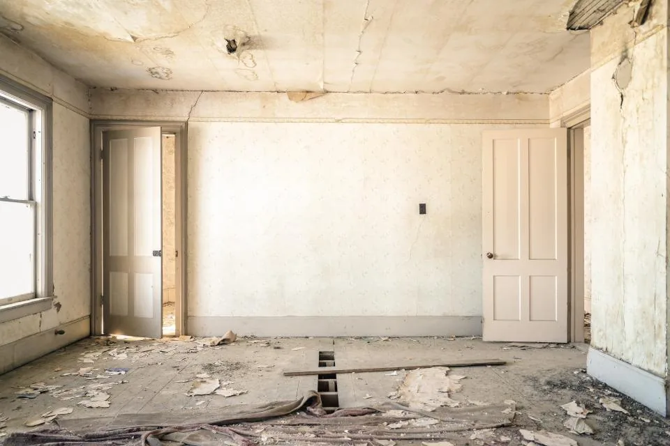Room under renovation with doors and windows